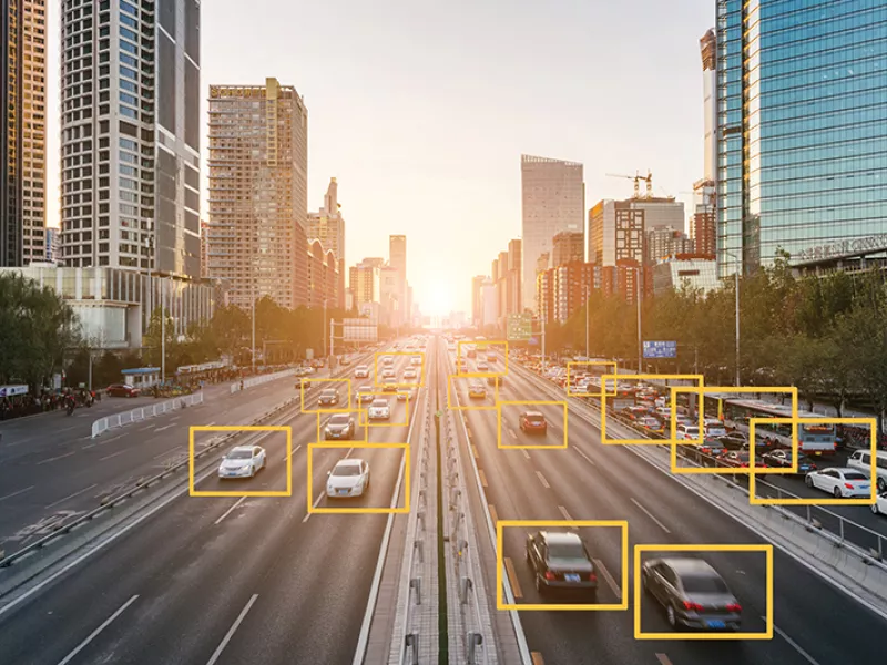 AI-powered traffic monitoring system analyzing vehicles on a busy city highway with real-time video analytics for intelligent traffic management and road safety solutions.